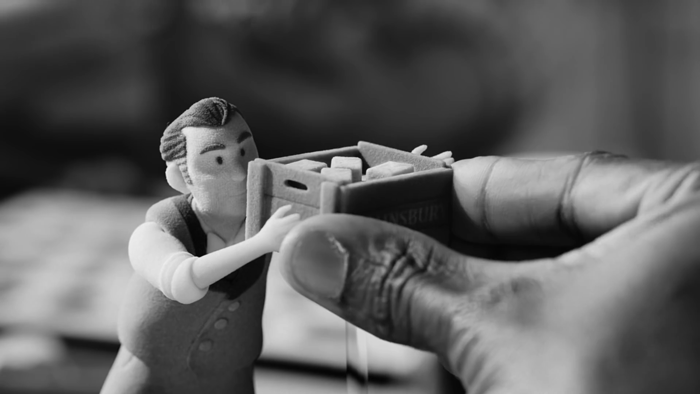 Holding a 3D-printed Mr Sainsbury figure